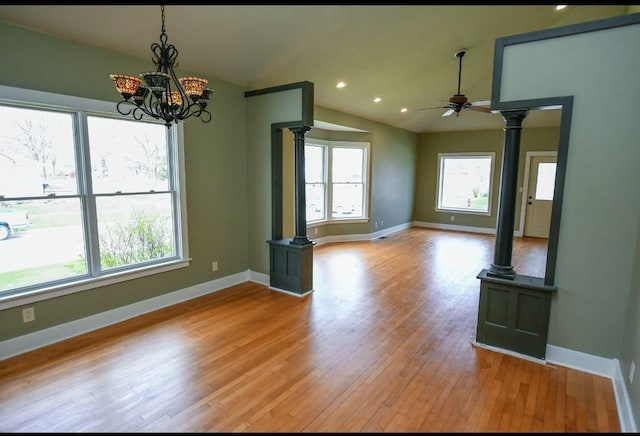 1604 Mamie Eisenhower Ave, Boone, IA 50036 - spare room featuring decorative columns, light wood-type flooring, a ceiling fan, baseboards, and lofted ceiling