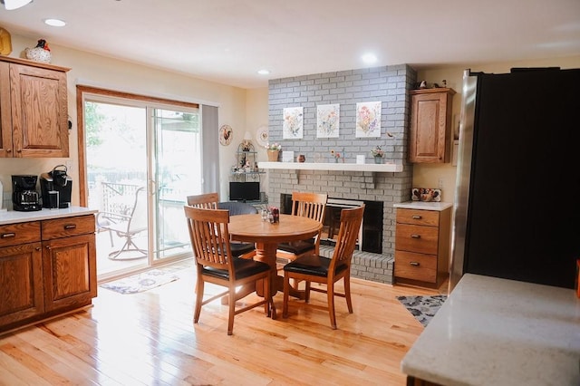 dining space featuring light wood-style floors and recessed lighting