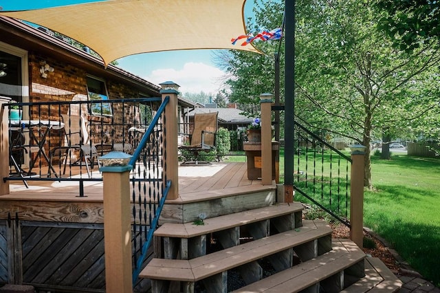 wooden terrace with a yard