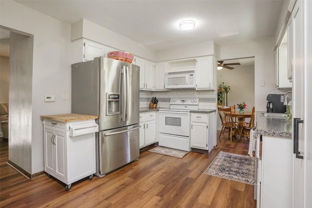 406 NW Kimberly Ln, Ankeny, IA 50023 - kitchen with white appliances, ceiling fan, dark wood-type flooring, and white cabinets