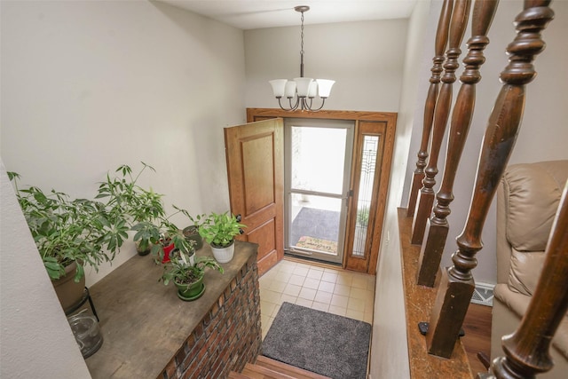 406 NW Kimberly Ln, Ankeny, IA 50023 - foyer with a chandelier and light tile patterned floors