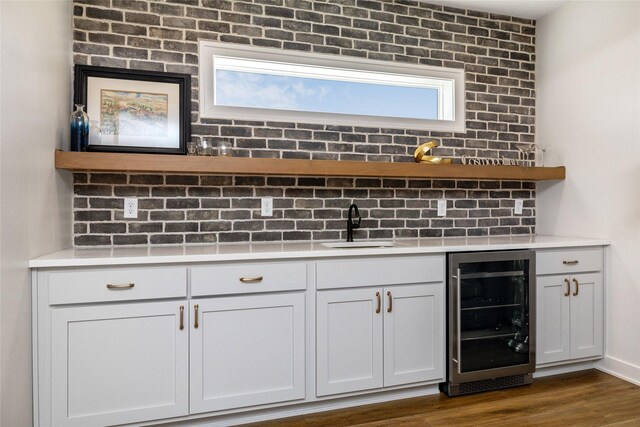 980 Daybreak Dr, Waukee, IA 50263 - detailed view of beverage cooler, wet bar, and wood finished floors