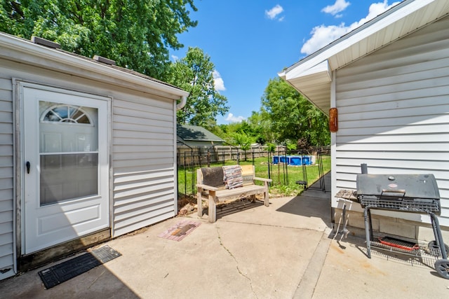 225 NW 50th Pl, Des Moines, IA 50313 - view of patio featuring fence and area for grilling