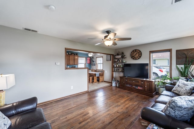 225 NW 50th Pl, Des Moines, IA 50313 - living room featuring a ceiling fan, wood finished floors, and baseboards