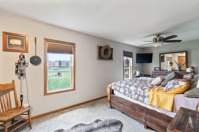 225 NW 50th Pl, Des Moines, IA 50313 - carpeted bedroom with baseboards and ceiling fan