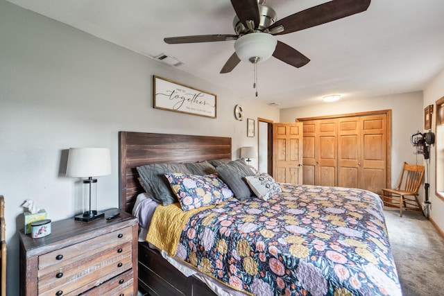 225 NW 50th Pl, Des Moines, IA 50313 - bedroom featuring carpet flooring, a closet, and ceiling fan