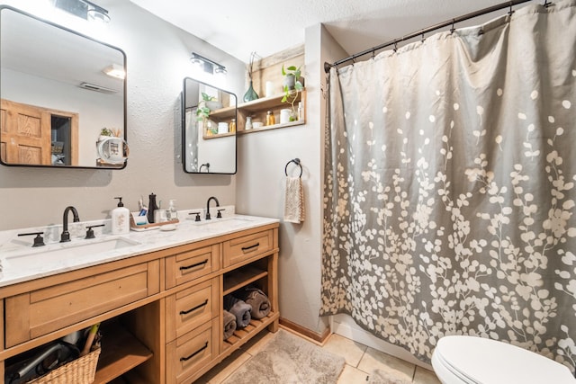 225 NW 50th Pl, Des Moines, IA 50313 - full bathroom with toilet, double vanity, tile patterned floors, and a shower with shower curtain