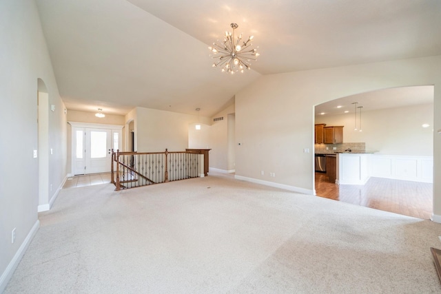 1420 Hannah Ln, Waukee, IA 50263 - unfurnished living room with arched walkways, light carpet, vaulted ceiling, baseboards, and a chandelier