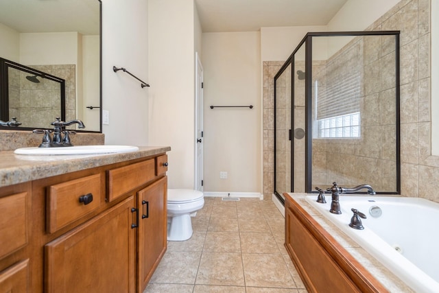 1420 Hannah Ln, Waukee, IA 50263 - full bathroom featuring a shower stall, vanity, a jetted tub, toilet, and tile patterned floors