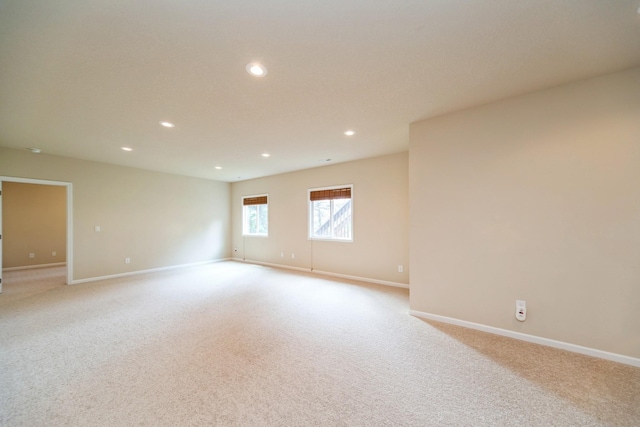 1420 Hannah Ln, Waukee, IA 50263 - empty room with recessed lighting, baseboards, and light colored carpet