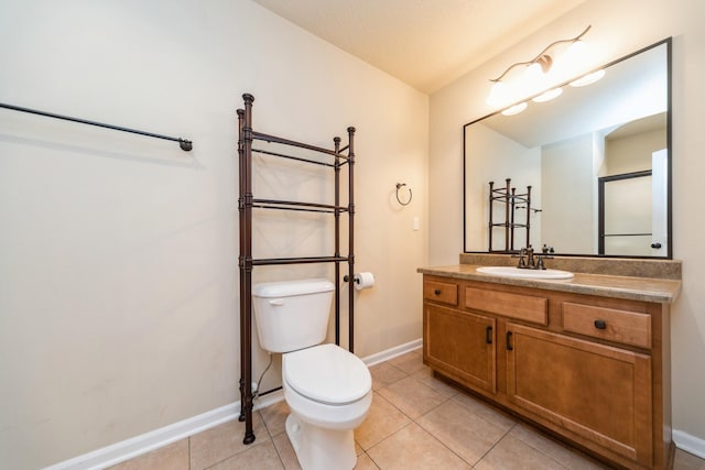 1420 Hannah Ln, Waukee, IA 50263 - bathroom with toilet, baseboards, vanity, and tile patterned flooring