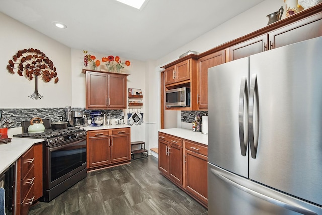 207 Kellogg Ave, Dallas Center, IA 50063 - kitchen featuring appliances with stainless steel finishes, decorative backsplash, light countertops, recessed lighting, and brown cabinetry