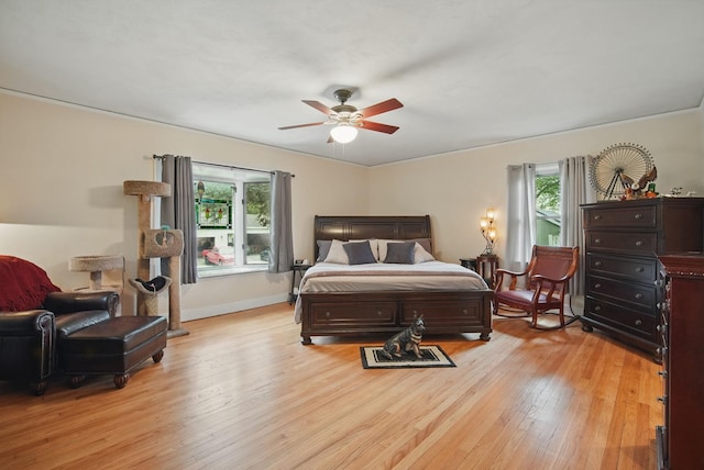 207 Kellogg Ave, Dallas Center, IA 50063 - bedroom with light wood-style floors, baseboards, and a ceiling fan