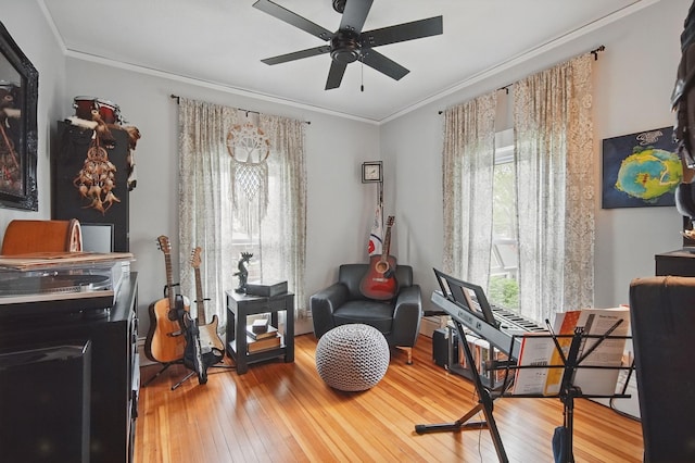 207 Kellogg Ave, Dallas Center, IA 50063 - sitting room featuring hardwood / wood-style floors, a ceiling fan, crown molding, and a desk