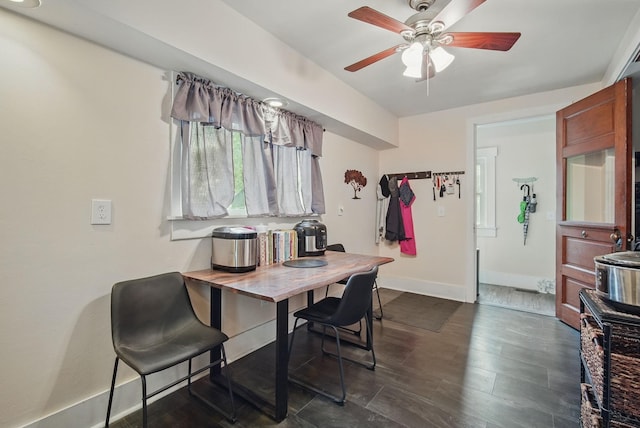 207 Kellogg Ave, Dallas Center, IA 50063 - dining area featuring ceiling fan, baseboards, and dark wood finished floors