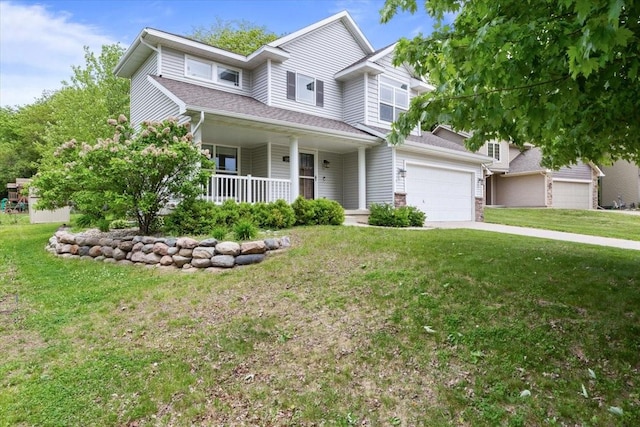 view of front of home featuring covered porch, a front yard, and concrete driveway