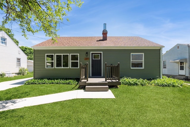 2311 50th St, Des Moines, IA 50310 - ranch-style house with a front lawn, a chimney, and roof with shingles