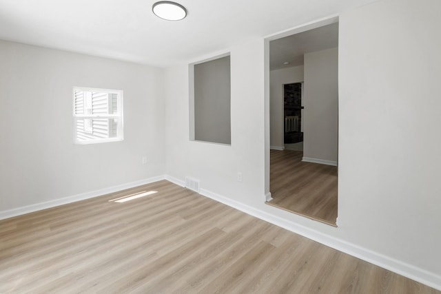 2311 50th St, Des Moines, IA 50310 - unfurnished room with wood finished floors and baseboards