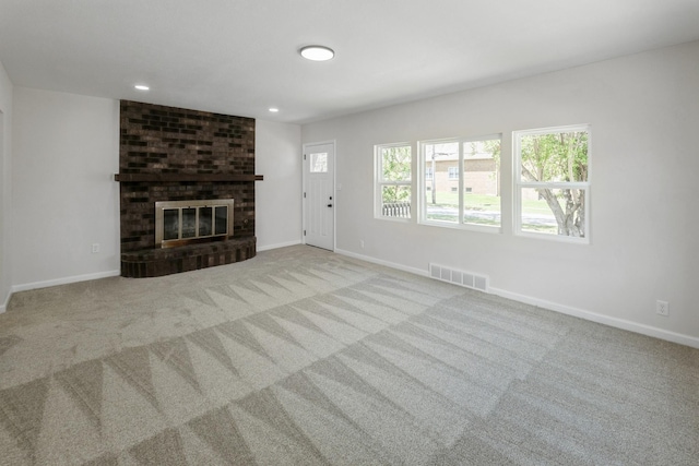 2311 50th St, Des Moines, IA 50310 - unfurnished living room with carpet flooring, baseboards, a brick fireplace, and recessed lighting