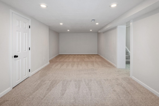 2311 50th St, Des Moines, IA 50310 - finished basement featuring light carpet, recessed lighting, baseboards, and stairs