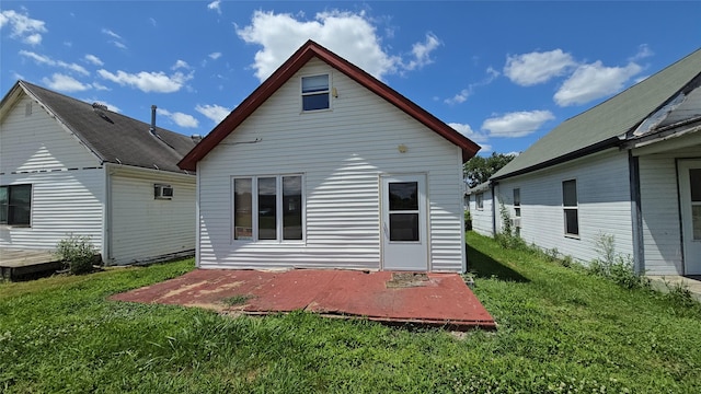 308 N Cherry St, Creston, IA 50801 - rear view of property featuring a lawn and a patio area