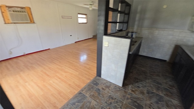 308 N Cherry St, Creston, IA 50801 - kitchen featuring a ceiling fan, wood finished floors, and an AC wall unit