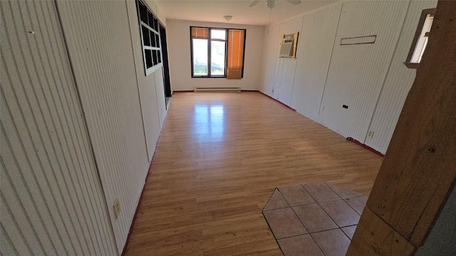 308 N Cherry St, Creston, IA 50801 - corridor featuring a baseboard heating unit and light wood-style floors