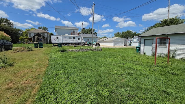 308 N Cherry St, Creston, IA 50801 - view of grassy yard with a detached garage