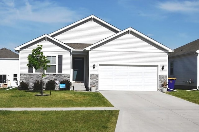 2010 N 7th St, Indianola, IA 50125 - single story home featuring stone siding, a garage, a front lawn, and driveway