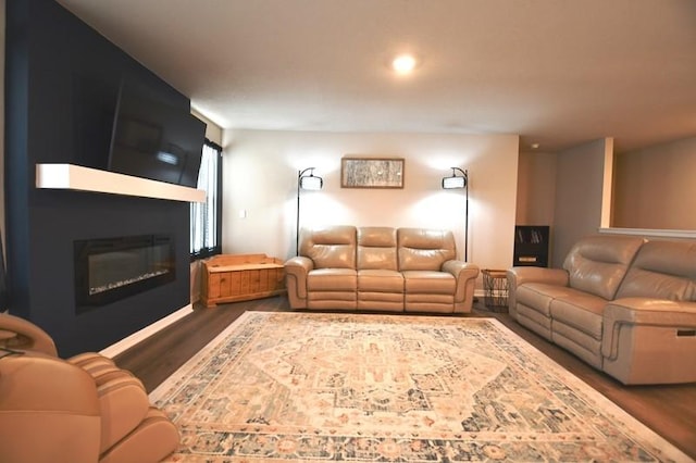 2010 N 7th St, Indianola, IA 50125 - living room with dark wood-type flooring and a glass covered fireplace