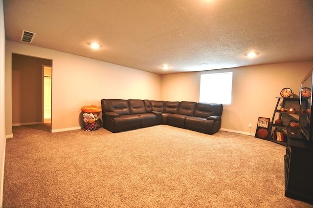2010 N 7th St, Indianola, IA 50125 - carpeted living room with a textured ceiling, baseboards, and recessed lighting