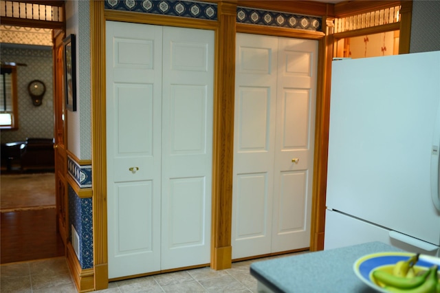 320 E 3rd St S, Newton, IA 50208 - kitchen featuring freestanding refrigerator and wallpapered walls