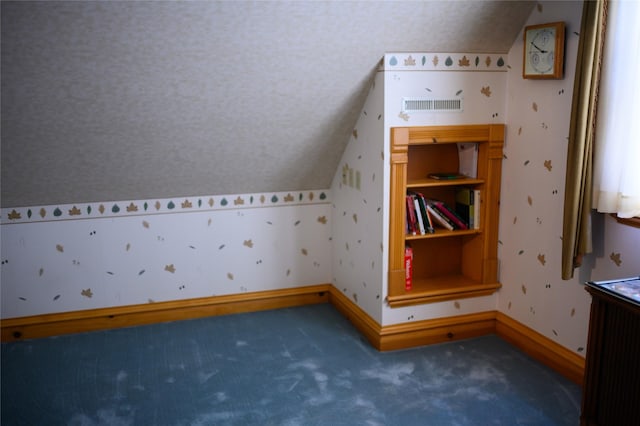 320 E 3rd St S, Newton, IA 50208 - additional living space featuring lofted ceiling, carpet flooring, and baseboards