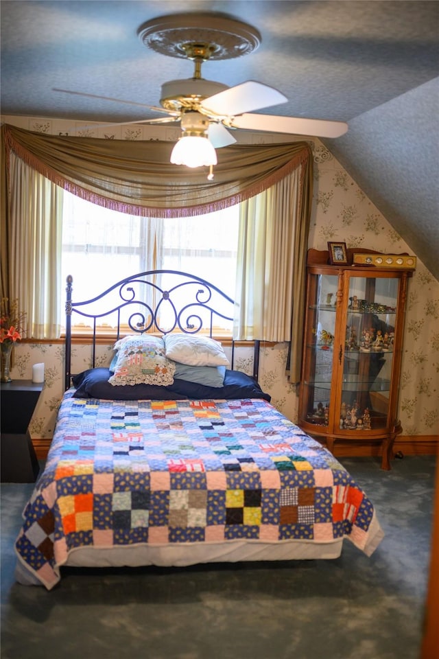320 E 3rd St S, Newton, IA 50208 - carpeted bedroom with wallpapered walls and vaulted ceiling