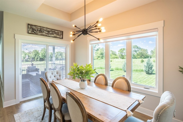 2770 NW 167th St, Clive, IA 50325 - dining room with baseboards, a chandelier, and light wood-style floors