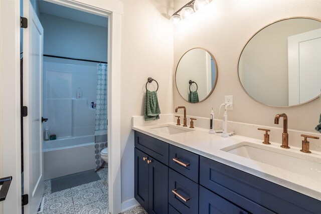 2770 NW 167th St, Clive, IA 50325 - bathroom featuring double vanity, shower / bath combo with shower curtain, and tile patterned flooring