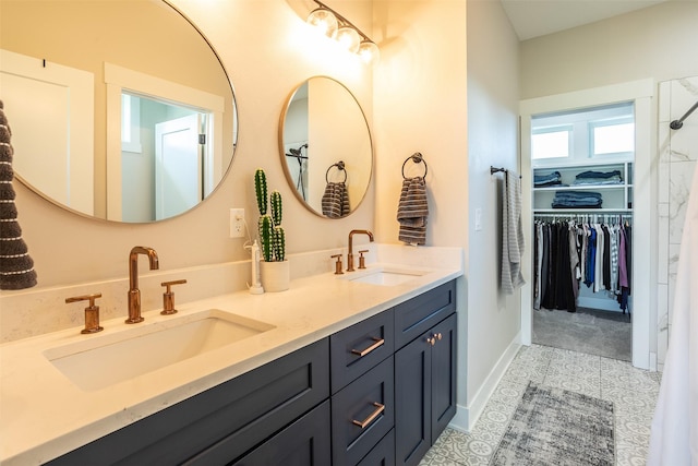 2770 NW 167th St, Clive, IA 50325 - full bathroom with double vanity, a spacious closet, and tile patterned flooring