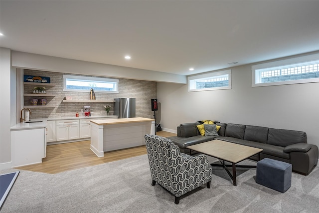 2770 NW 167th St, Clive, IA 50325 - living room with recessed lighting, light wood-style floors, light carpet, and baseboards