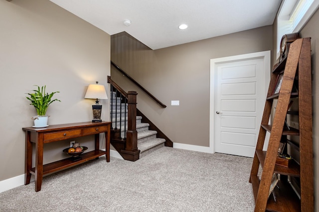 stairway featuring carpet floors, baseboards, and recessed lighting