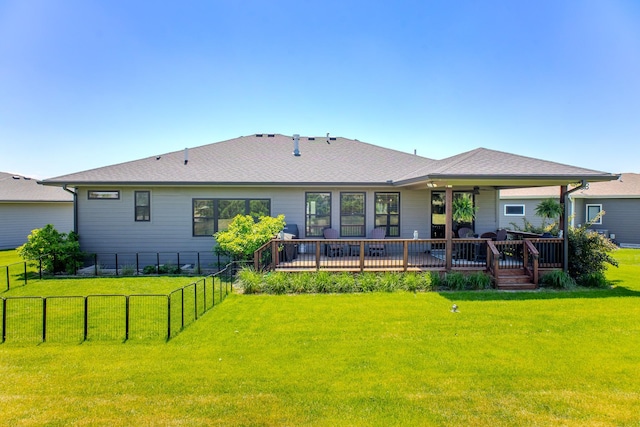 rear view of house featuring a deck