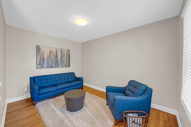 947 11th Ave SE, Altoona, IA 50009 - living area with baseboards and wood finished floors