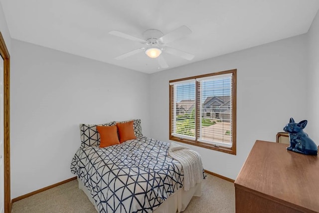 947 11th Ave SE, Altoona, IA 50009 - bedroom with carpet floors, baseboards, and ceiling fan
