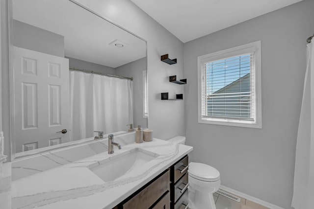 947 11th Ave SE, Altoona, IA 50009 - full bathroom featuring toilet, baseboards, vanity, and a shower with shower curtain