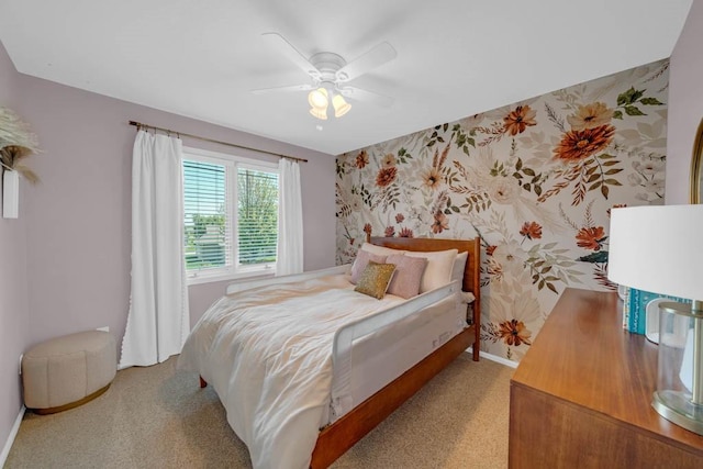 947 11th Ave SE, Altoona, IA 50009 - bedroom with baseboards, wallpapered walls, light colored carpet, and ceiling fan