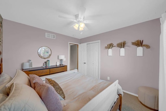 947 11th Ave SE, Altoona, IA 50009 - bedroom with carpet, baseboards, a closet, and ceiling fan
