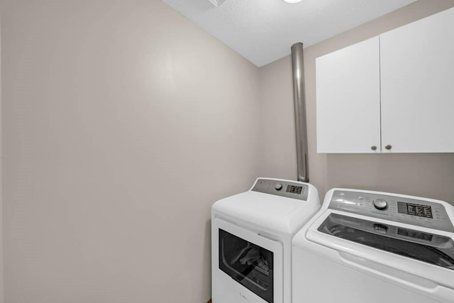 947 11th Ave SE, Altoona, IA 50009 - laundry area with cabinet space and washer and clothes dryer
