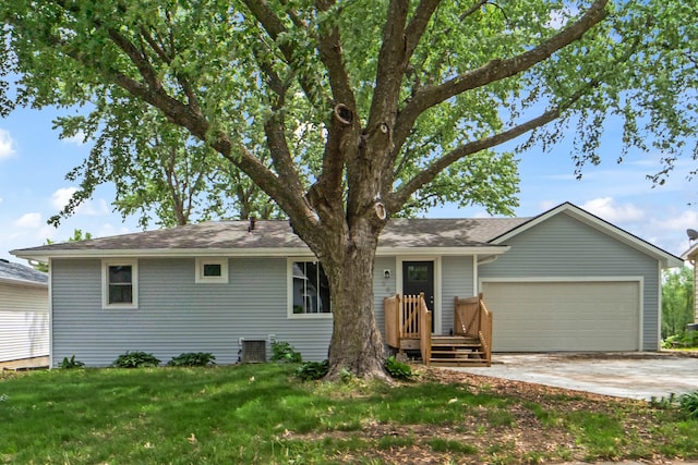 208 Van Buren Dr, Van Meter, IA 50261 - ranch-style home featuring an attached garage, a front lawn, driveway, cooling unit, and a shingled roof