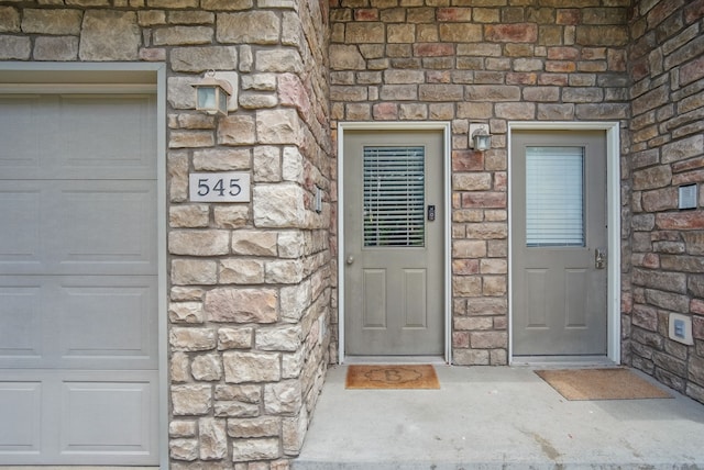 545 Maggie Ln, Altoona, IA 50009 - view of exterior entry featuring stone siding