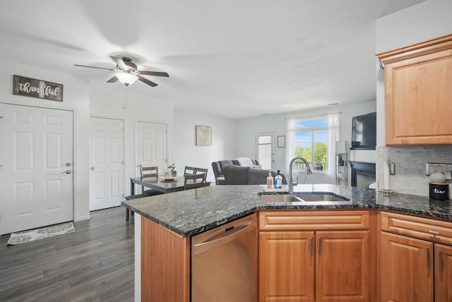 545 Maggie Ln, Altoona, IA 50009 - kitchen with a sink, dishwasher, a ceiling fan, and dark stone counters