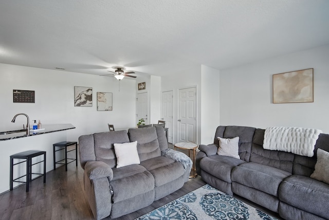 545 Maggie Ln, Altoona, IA 50009 - living area featuring dark wood-style floors and a ceiling fan